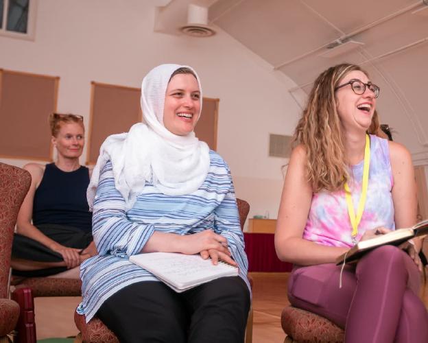 Learn Grant Writing members laugh while attending a course together